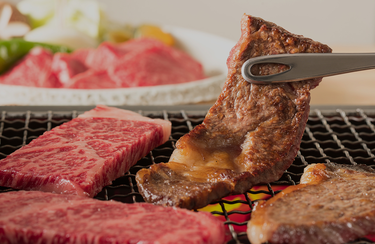 Chef preparing wagyu beef on a grill