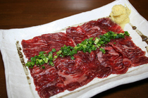 Hakata Mizutaki-style Motsu Nabe Motsufuji_A large portion of "Basashi" (raw horse meat).