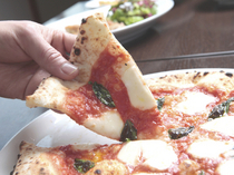 Pizzeria Austro_Margherita: a luxurious treat we're proud to serve! Features an exquisite harmony of flavors.