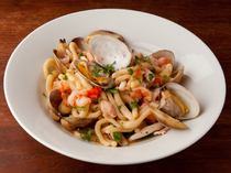AURELIO_ [Strozzapreti - Seafood Pasta with Fresh Tomato Sauce] using hand-made pasta in a sauce with a rich savory taste of seafood. 
