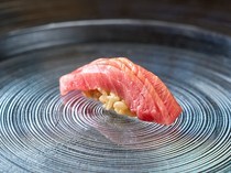 Sushi Yon_Medium-fatty Tuna - Using hidden cuts on the tuna brings surprise and delight with the delicious taste.