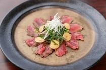 Yakiniku Tanmiya_Tanmiya's Specialty: Beef Tataki (Wagyu Beef) - A perfect match with wine! It offers a rich harmony of vegetable and meat flavors.