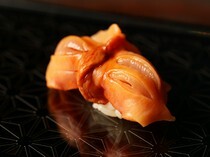 Sushi Niebana_Ark Shell Nigiri Sushi - Its crunchy texture characterizes it. It is a popular item with an irresistible aroma of the sea, sweetness, and flavor.